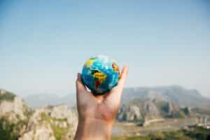 person holding the globe